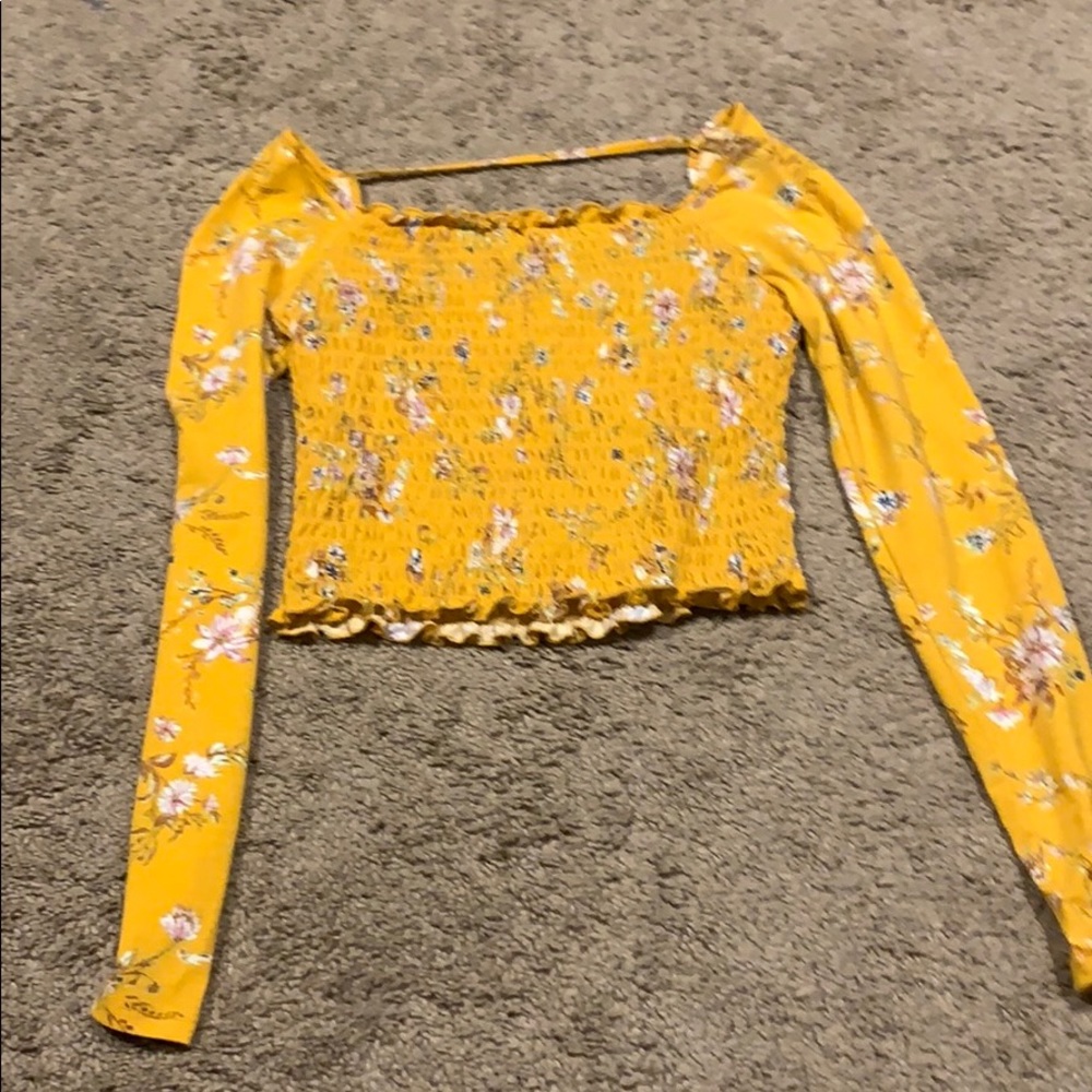 A yellow orangish crop top